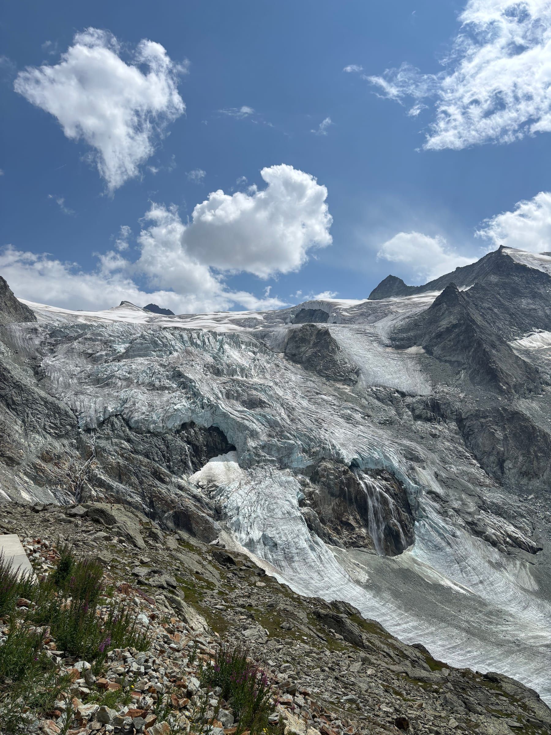Seracs of the Moiry glacier and a meltwater waterfall, seen up close from near the hut